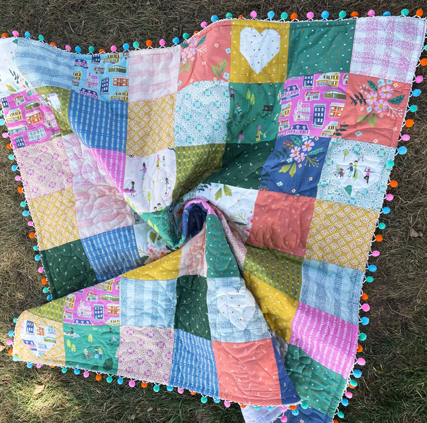 Simple Patchwork Quilt with Pom Pom Binding